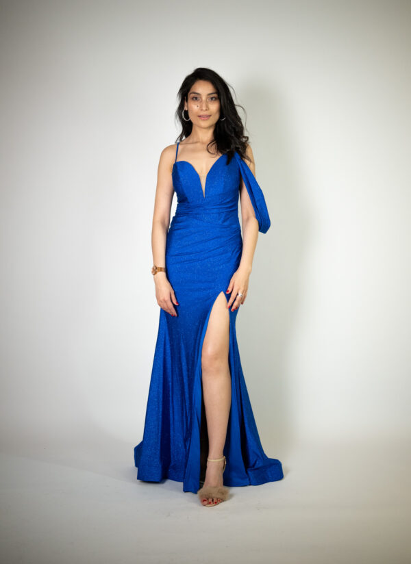 Alt text: "Royal blue sparkly satin gown called Lottie, featuring a sweetheart neckline, off-the-shoulder details, and a high slit, perfect for glamorous occasions."