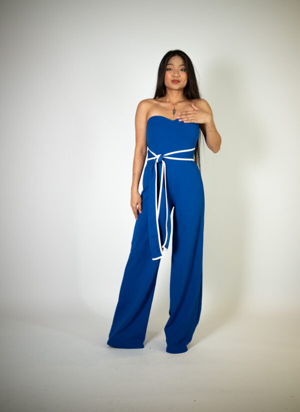 Alt text: "Strapless blue jumpsuit called Lapras, featuring a white and blue belt, perfect for special occasions."