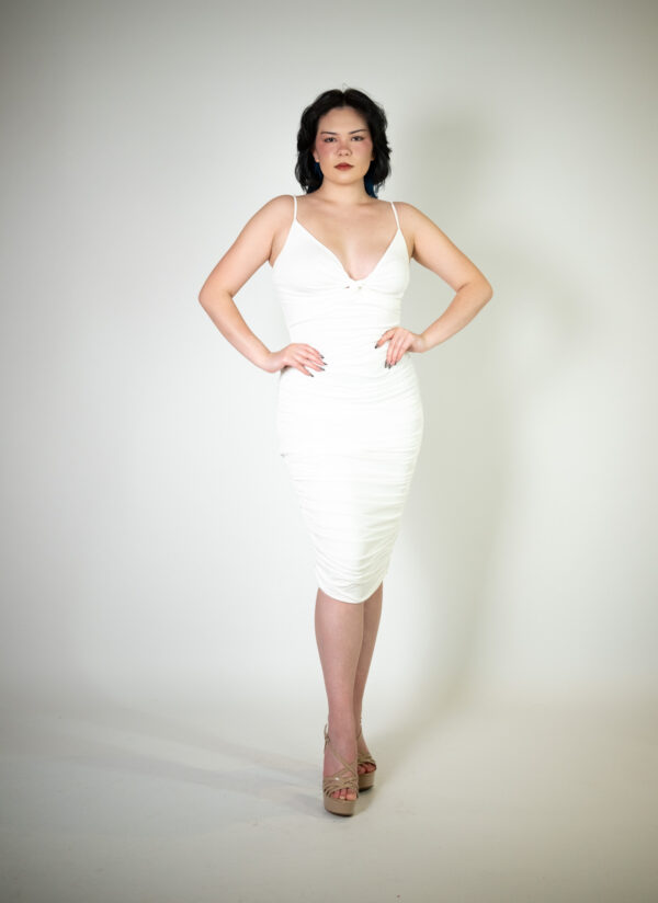 White midi dress called Chiara, featuring intricate mesh ruching, perfect for glamorous occasions."