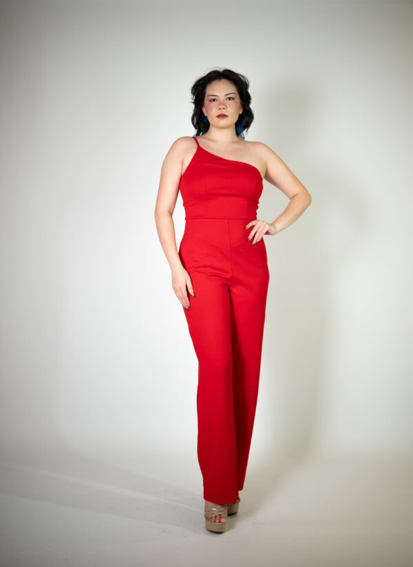 Alt text: "Red jumpsuit called Midge, featuring a one-strap design and straight legs, perfect for special occasions."