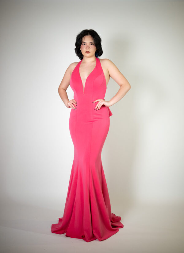 Alt text: "Dusty pink off-the-shoulder gown called Susie, featuring a glitter pattern and ruffles, perfect for glamorous occasions. Size fits: 4-6."