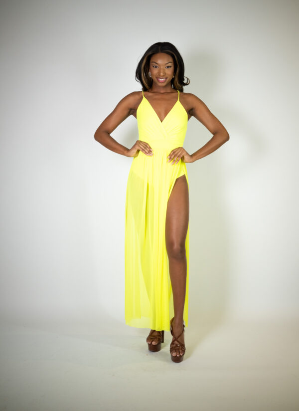 Alt text: "Neon yellow bodysuit dress called UV Dress, featuring a tulle overskirt and dual slits, perfect for special occasions."