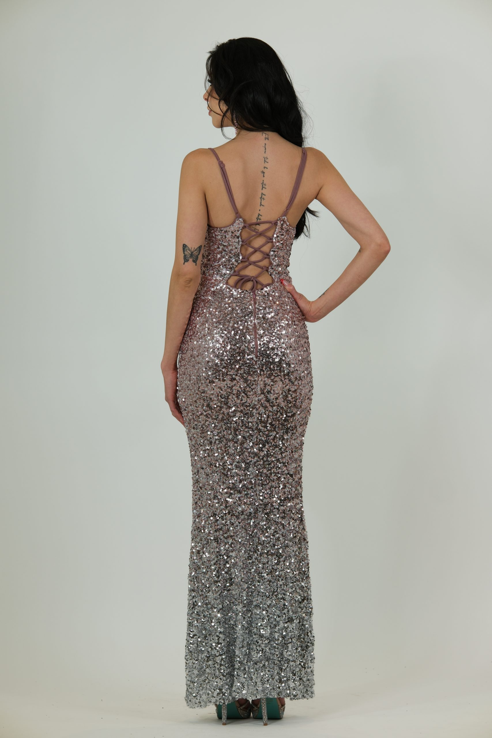 "Rose to silver ombré sequin gown with deep V-neckline and fitted silhouette."