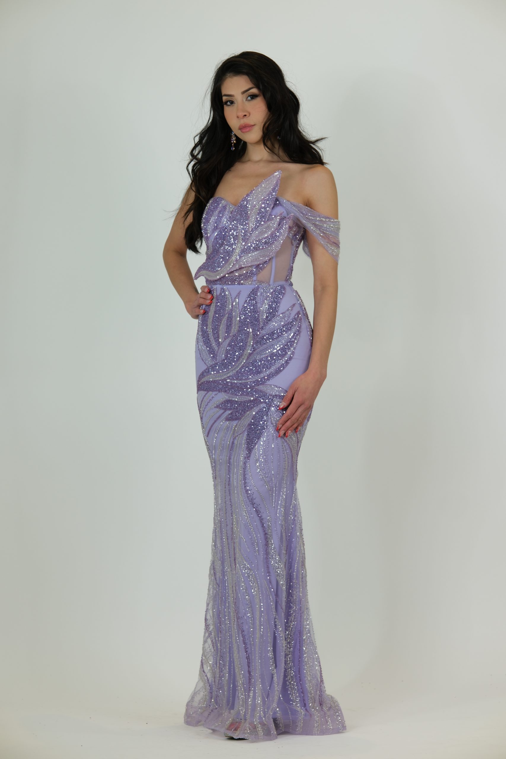 “Lilac sequin evening gown with off-shoulder applique detailing, sheer side panels, fitted skirt, and optional detachable chiffon cape.”