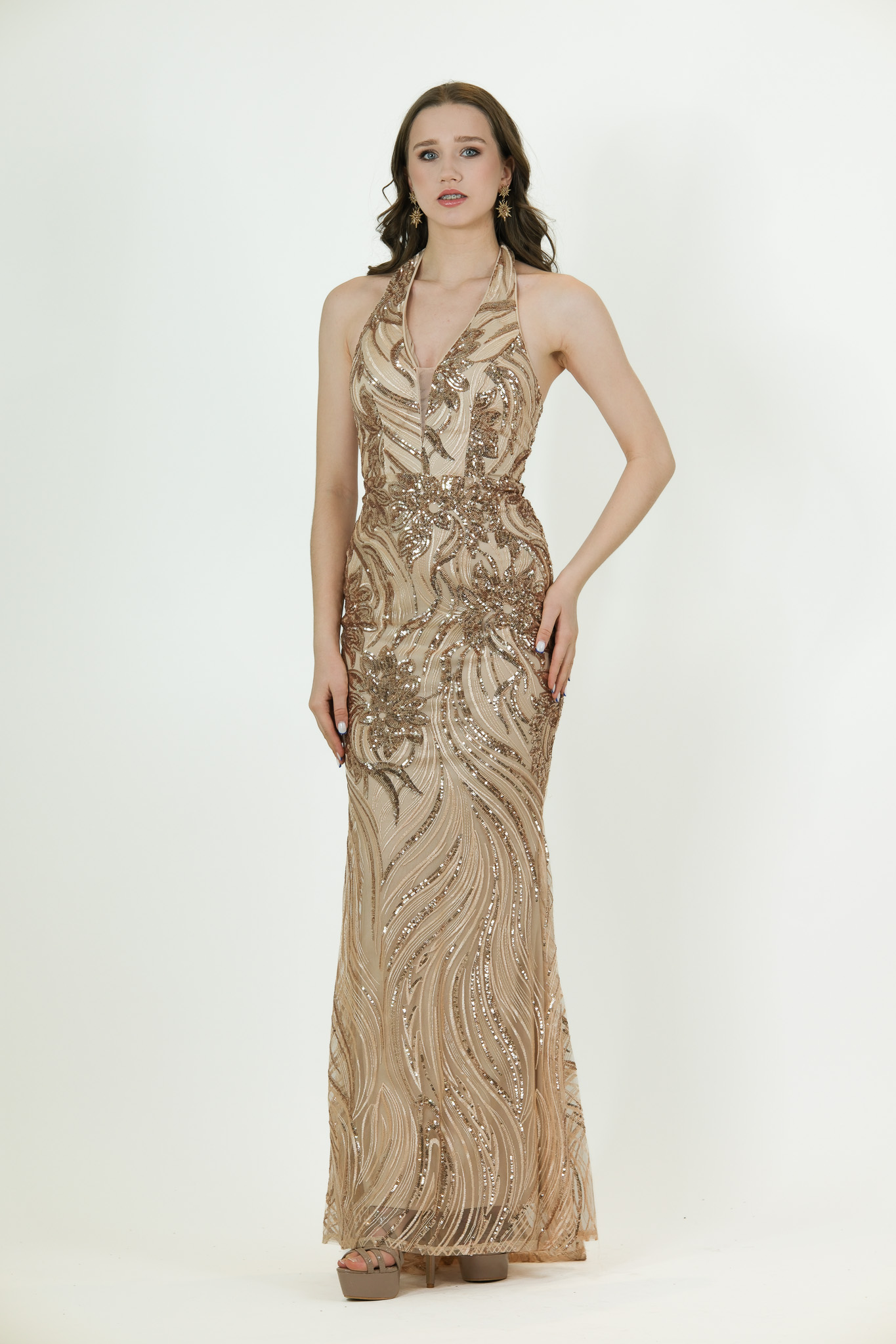 “Gold halter-neck sequin gown with detailed beading and fitted full-length silhouette.”